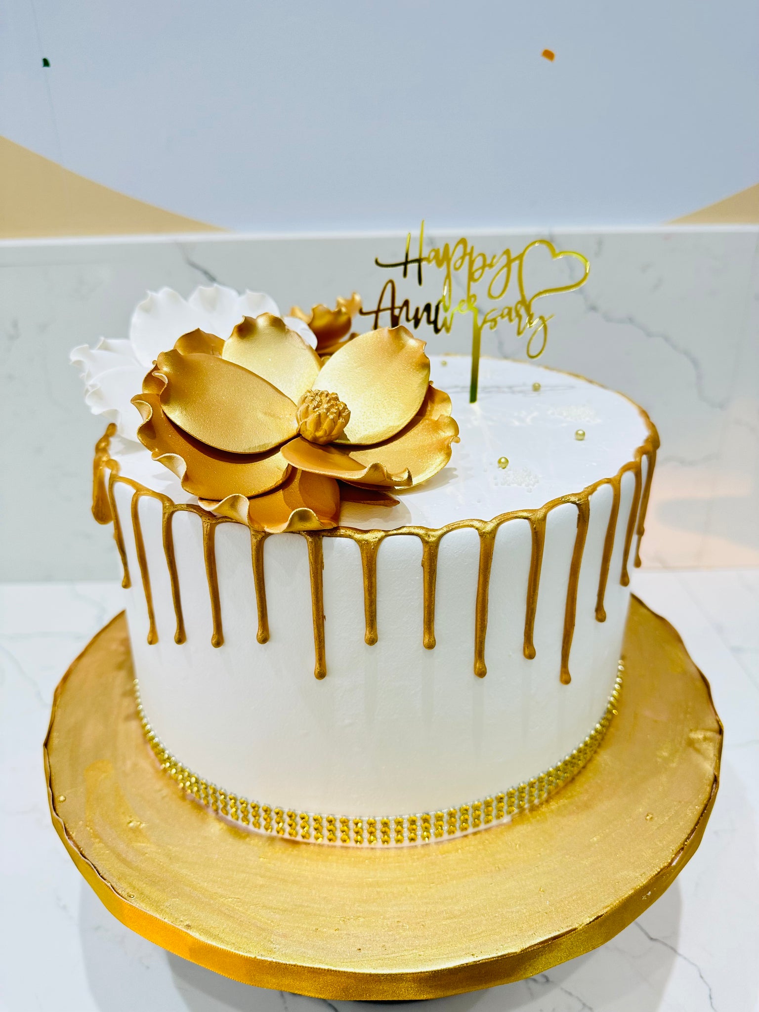 WHITE & GOLD ANNIVERSARY FLORAL CAKE - Rashmi's Bakery